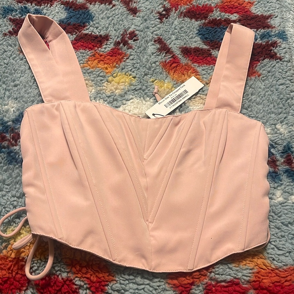 Blush colored crop corset top with a zipper in the back
